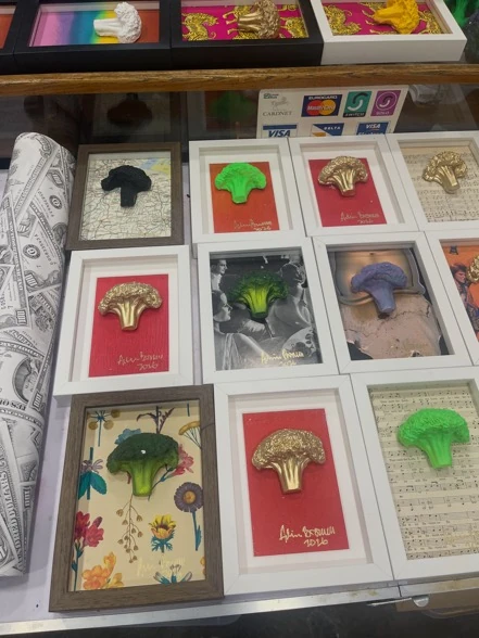Autographed broccoli artwork in different colours