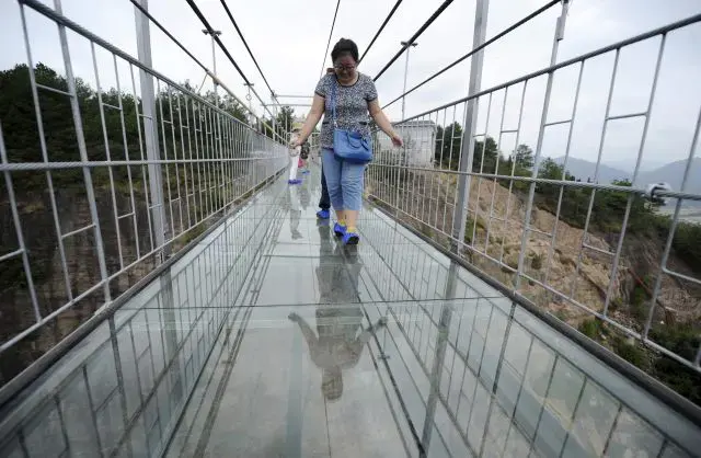 Longest glass bridge on Earth opens 2