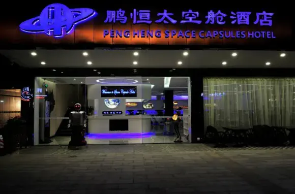 A Futuristic Capsule Hotel Where Robots Serve Their Human Overlords