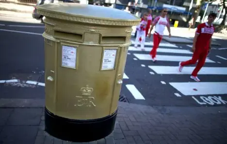 Britain's iconic red mailboxes get golden makeover