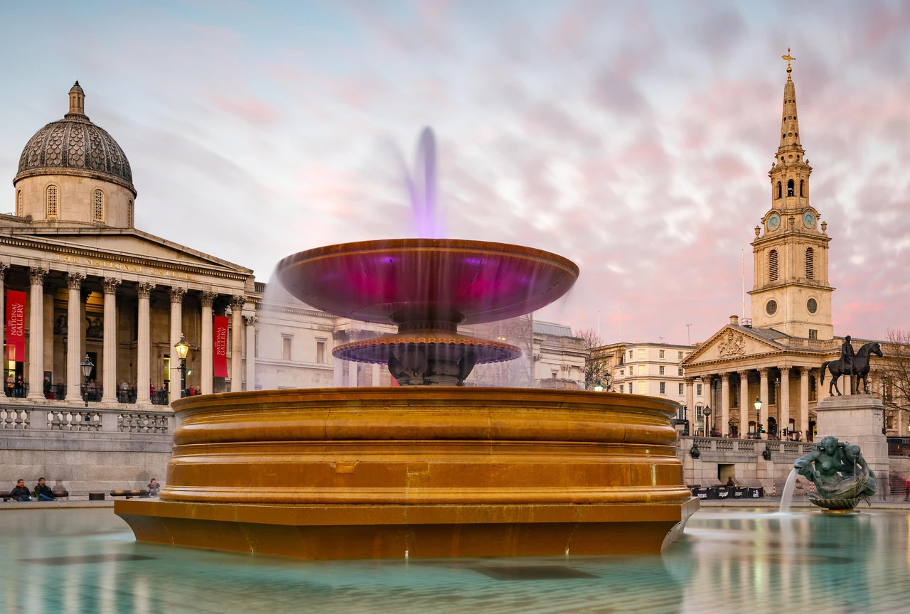 Trafalgar Square fountain with the National Gallery in London