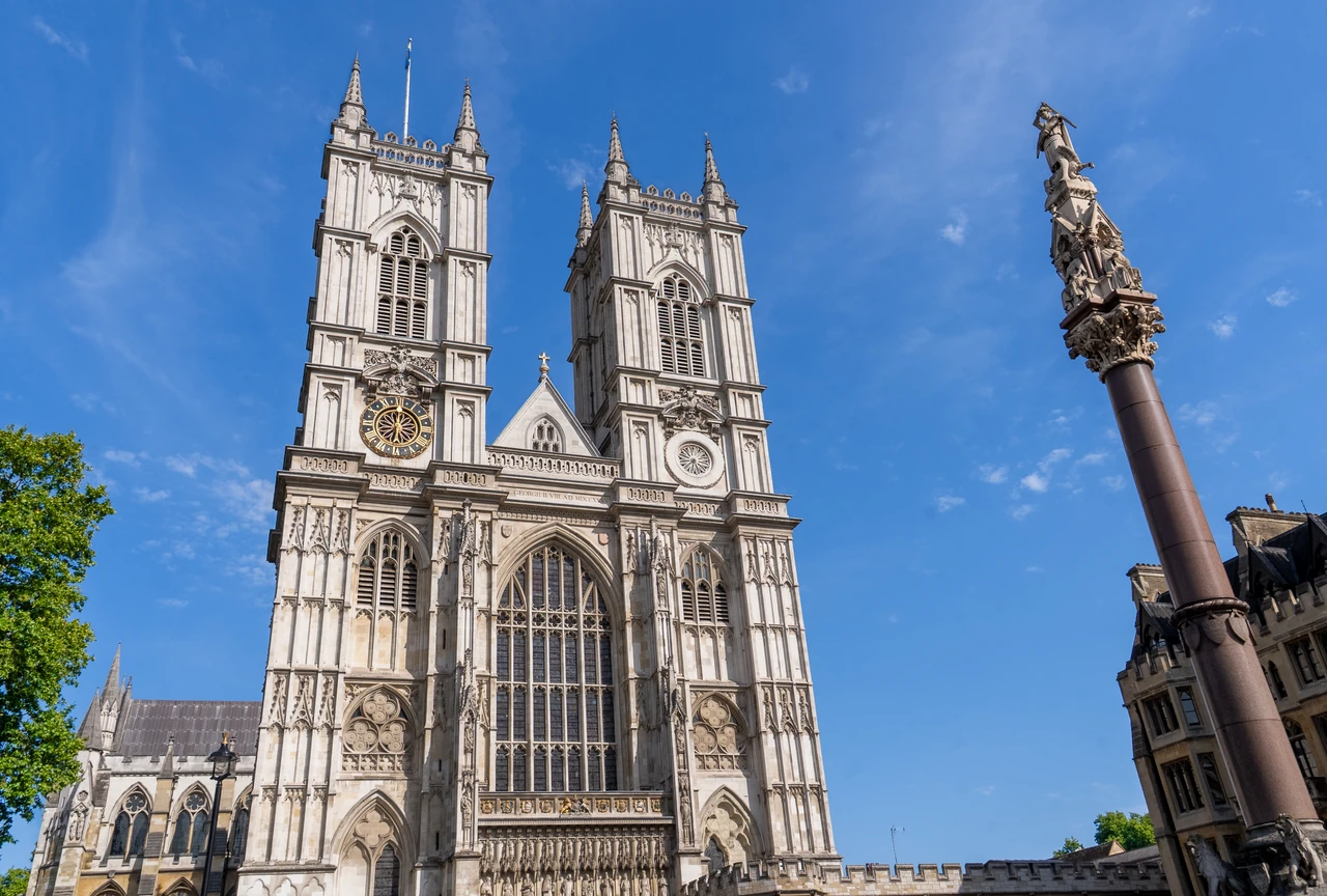 Westminster Abbey west front under a blue sky in London