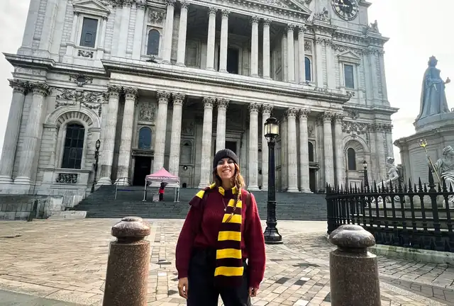 Visitor outside St Paul's Cathedral in London